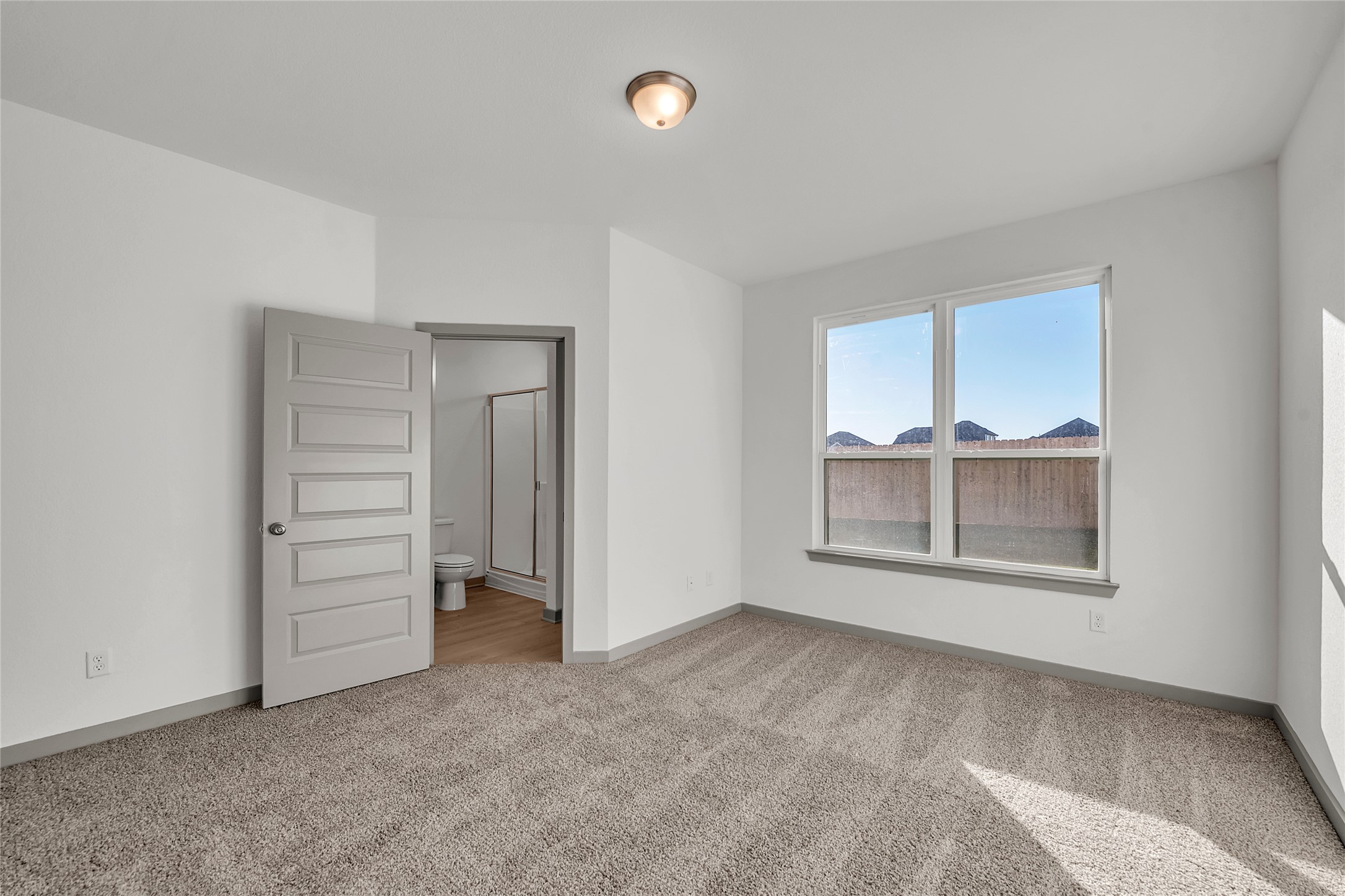 270 Boatright Boulevard Jarrell, TX 76537 - Photo 11 of 30 an empty room with a empty space and windows