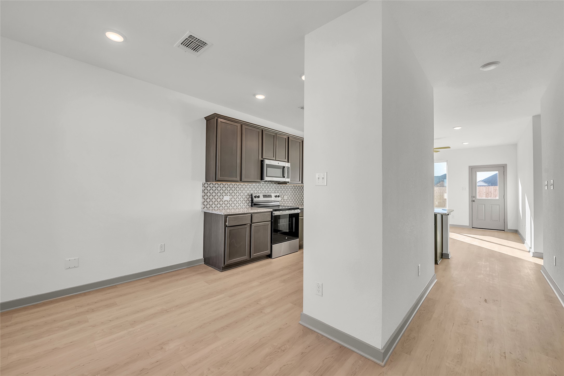 270 Boatright Boulevard Jarrell, TX 76537 - Photo 18 of 30 a view of a kitchen with a sink and dishwasher