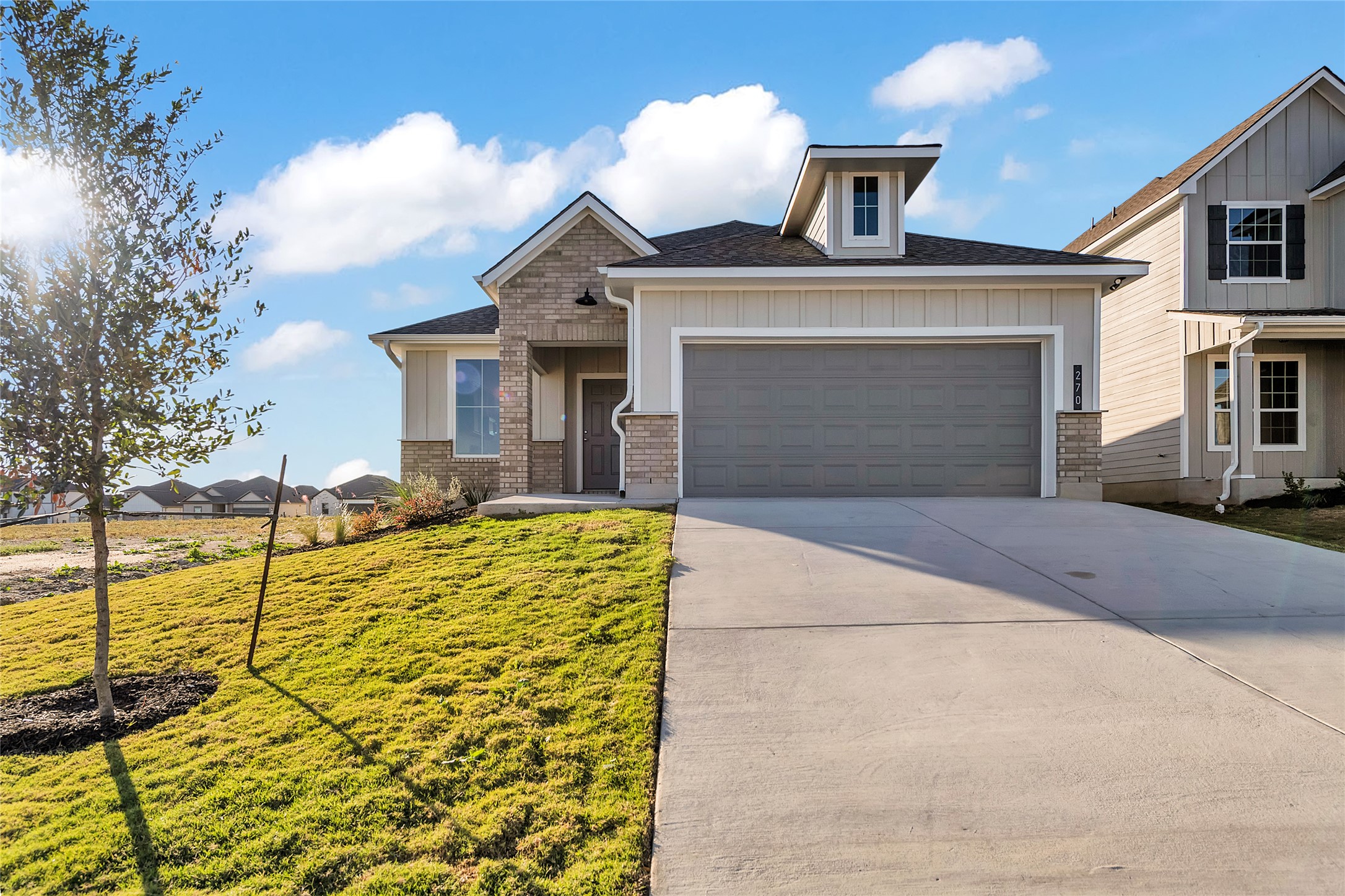 270 Boatright Boulevard Jarrell, TX 76537 - Photo 2 of 30 a front view of a house with yard