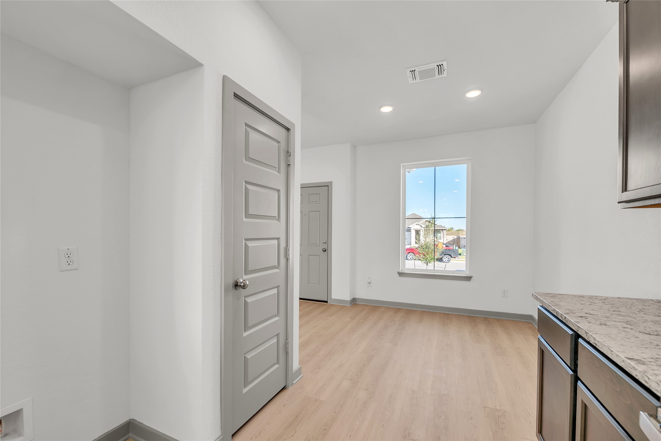 270 Boatright Boulevard Jarrell, TX 76537 - Photo 22 of 30 a view of an empty room with a window and wooden floor