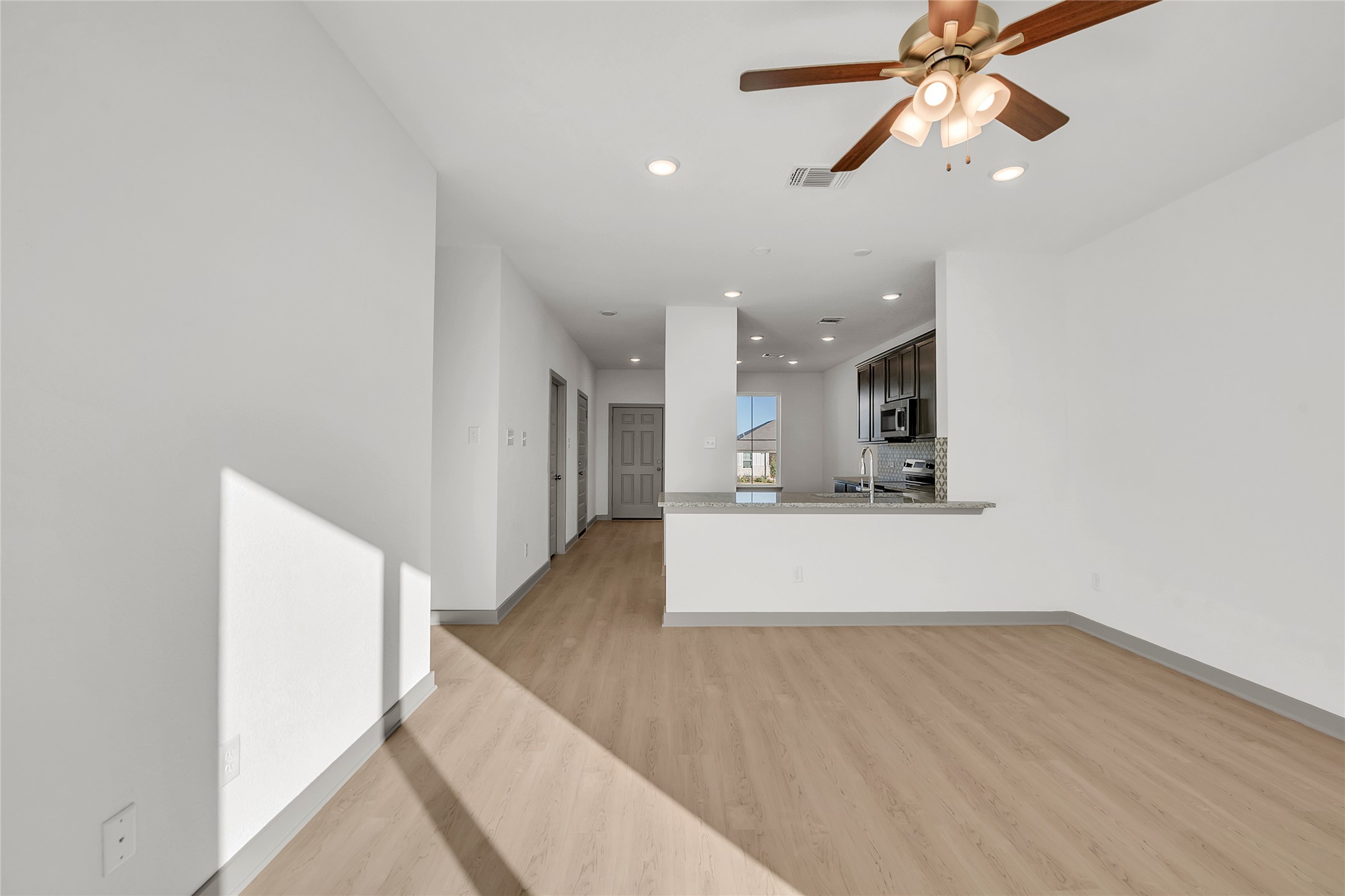 270 Boatright Boulevard Jarrell, TX 76537 - Photo 27 of 30 a view of kitchen and hall with wooden floor