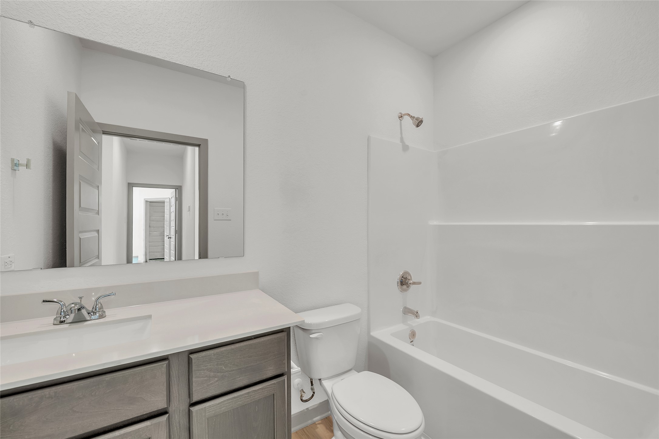 270 Boatright Boulevard Jarrell, TX 76537 - Photo 5 of 30 a bathroom with a sink a toilet and shower