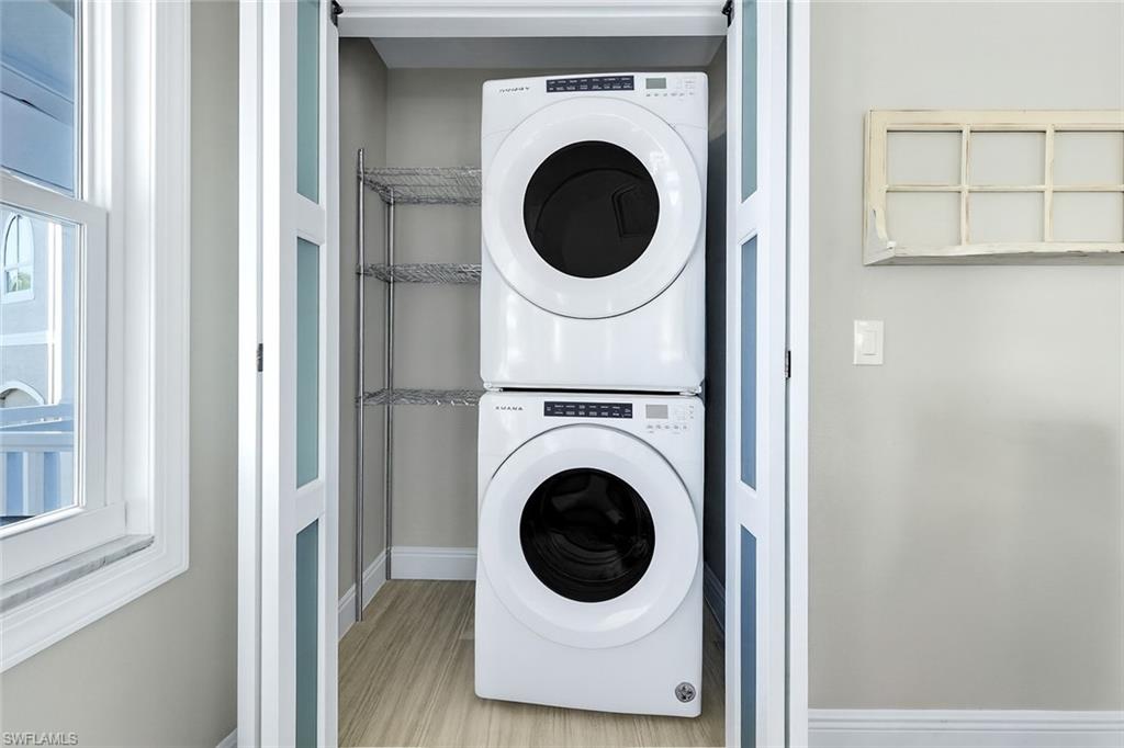 100 Tarpon Road Fort Myers Beach, FL 33931 - Photo 23 of 49 a utility room with dryer and washer