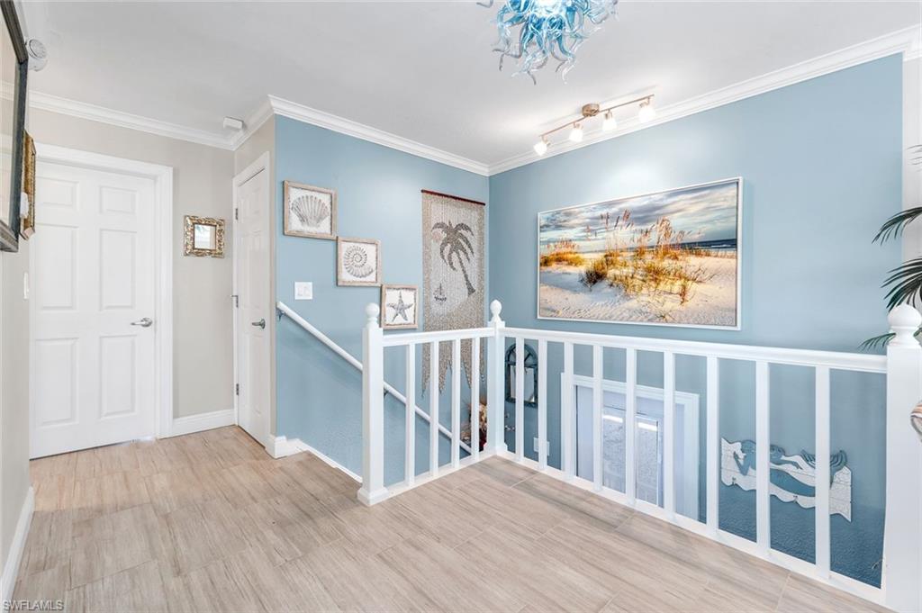 100 Tarpon Road Fort Myers Beach, FL 33931 - Photo 24 of 49 a view of hallway with wooden floor
