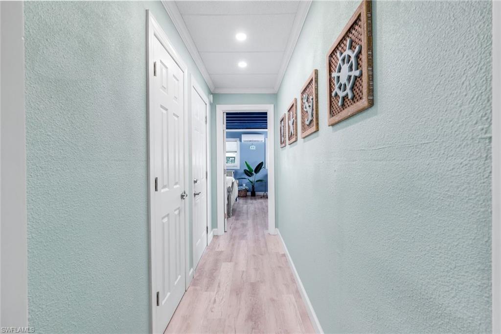 100 Tarpon Road Fort Myers Beach, FL 33931 - Photo 26 of 49 a view of a hallway with wooden floor and staircase