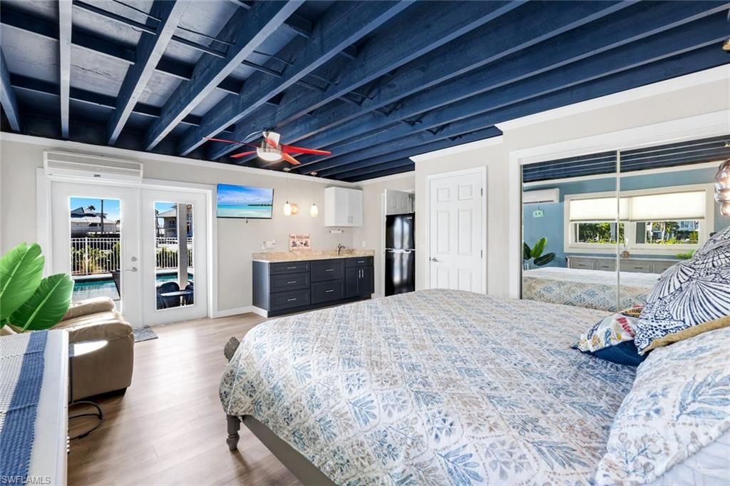 100 Tarpon Road Fort Myers Beach, FL 33931 - Photo 28 of 49 a large bed sitting in a spacious bedroom next to a window