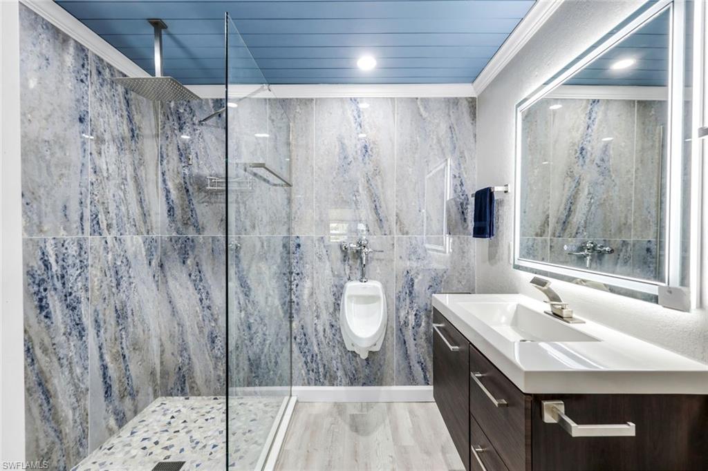 100 Tarpon Road Fort Myers Beach, FL 33931 - Photo 29 of 49 a bathroom with a sink a toilet and shower