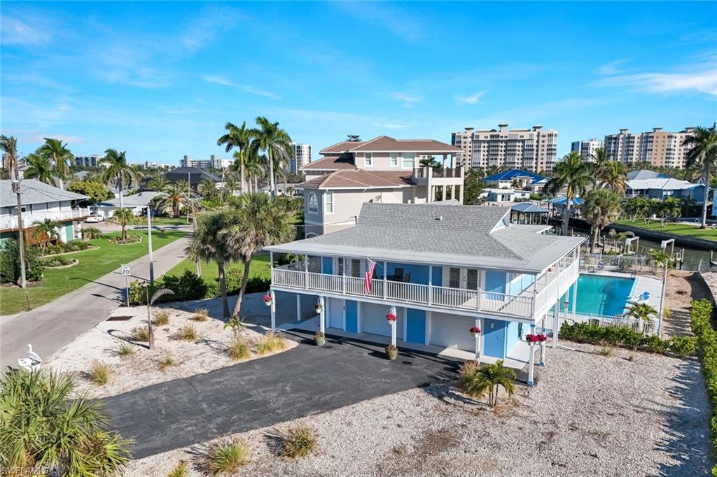 100 Tarpon Road Fort Myers Beach, FL 33931 - Photo 30 of 49 a view of a large building with a yard