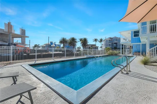 a view of a swimming pool with a patio