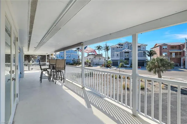 a view of balcony with a floor to ceiling window and wooden floor