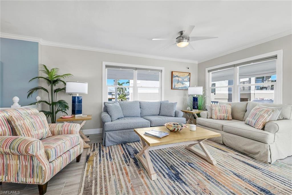 100 Tarpon Road Fort Myers Beach, FL 33931 - Photo 4 of 49 a living room with furniture and a rug