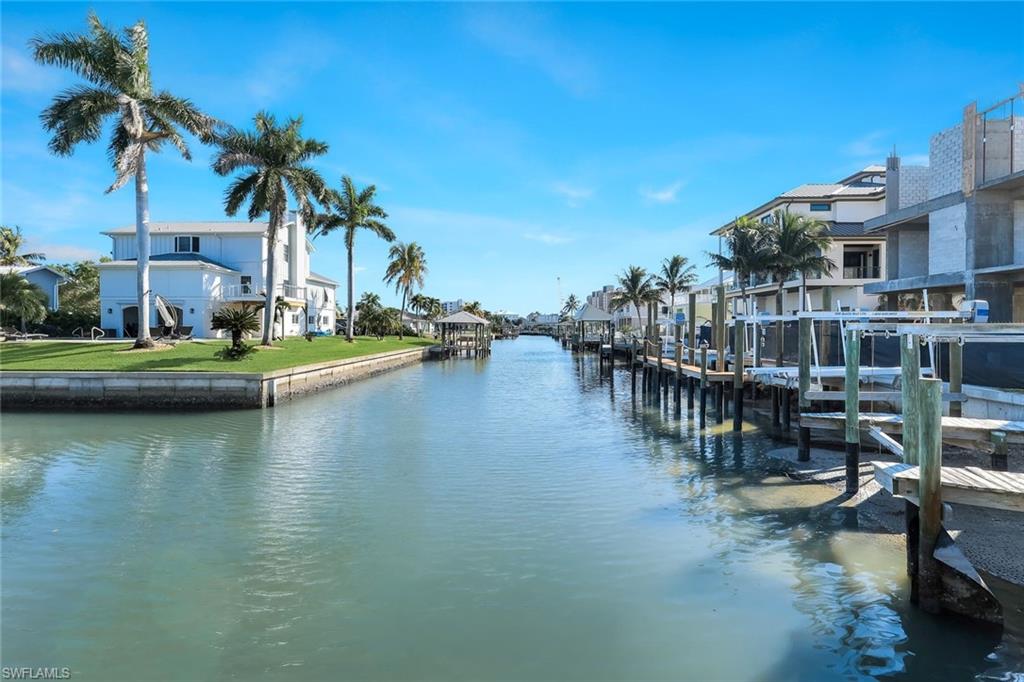 100 Tarpon Road Fort Myers Beach, FL 33931 - Photo 43 of 49 a view of swimming pool with outdoor seating and lake view