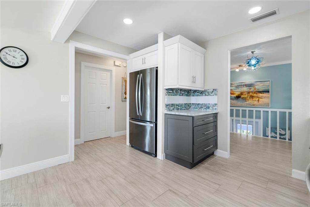 100 Tarpon Road Fort Myers Beach, FL 33931 - Photo 10 of 49 a kitchen with stainless steel appliances granite countertop a refrigerator and a stove