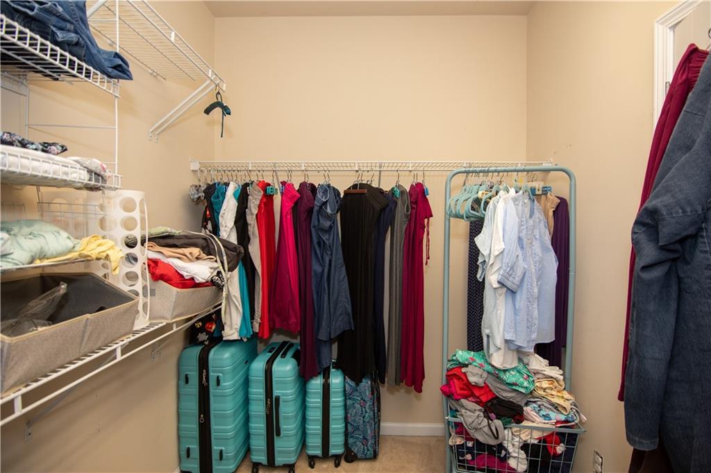 213 Oakleaf Drive Acworth, GA 30102 - Photo 19 of 24 a view of walk in closet with clothes and shoes