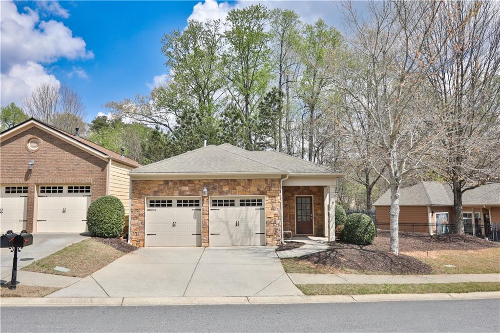 213 Oakleaf Drive Acworth, GA 30102 - Photo 2 of 24 a white house that has a tree in front of it