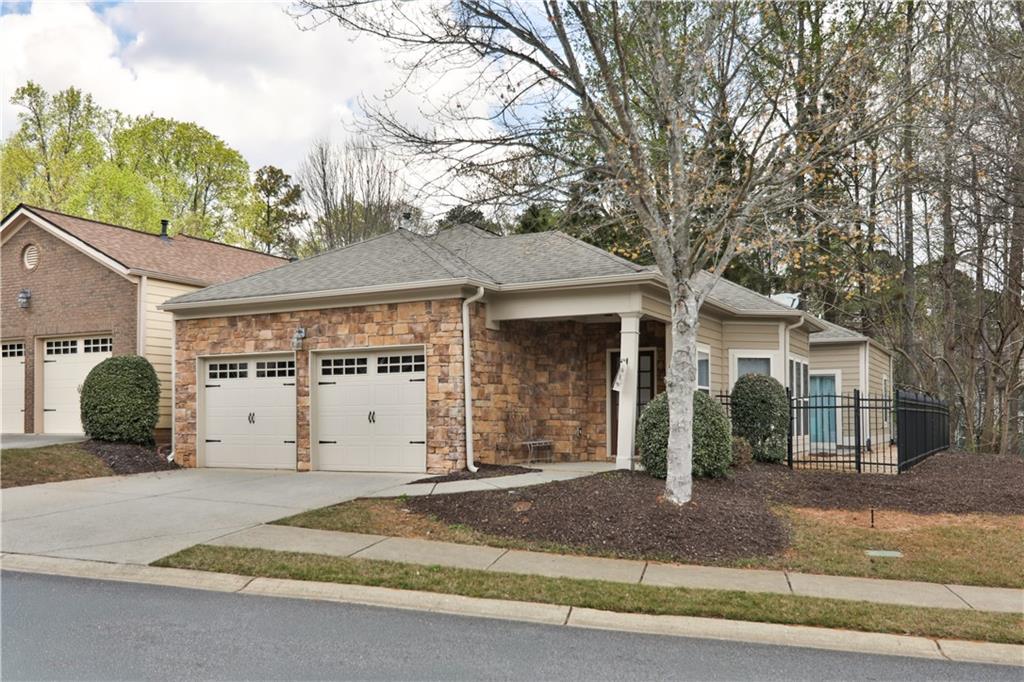 213 Oakleaf Drive Acworth, GA 30102 - Photo 3 of 24 a front view of a house with a yard and garage