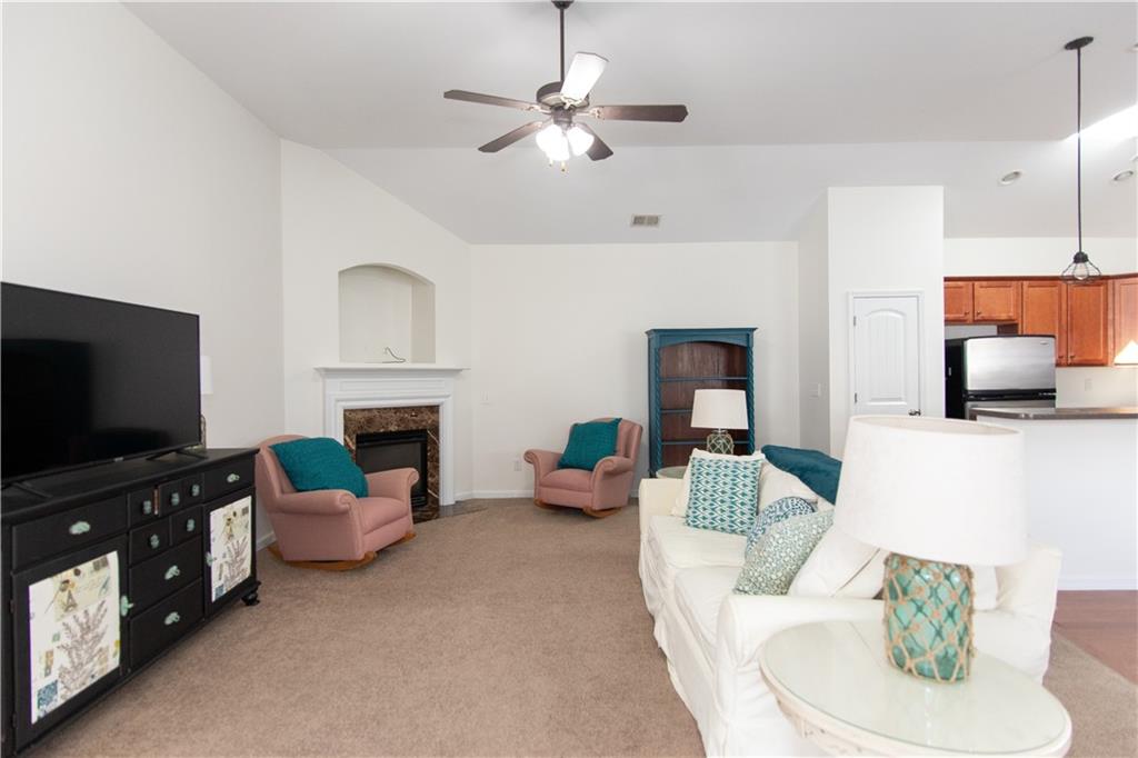 213 Oakleaf Drive Acworth, GA 30102 - Photo 6 of 24 a living room with furniture and a flat screen tv