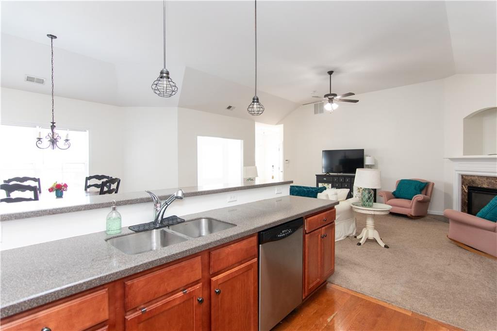 213 Oakleaf Drive Acworth, GA 30102 - Photo 10 of 24 a kitchen with a sink appliances and a counter top space