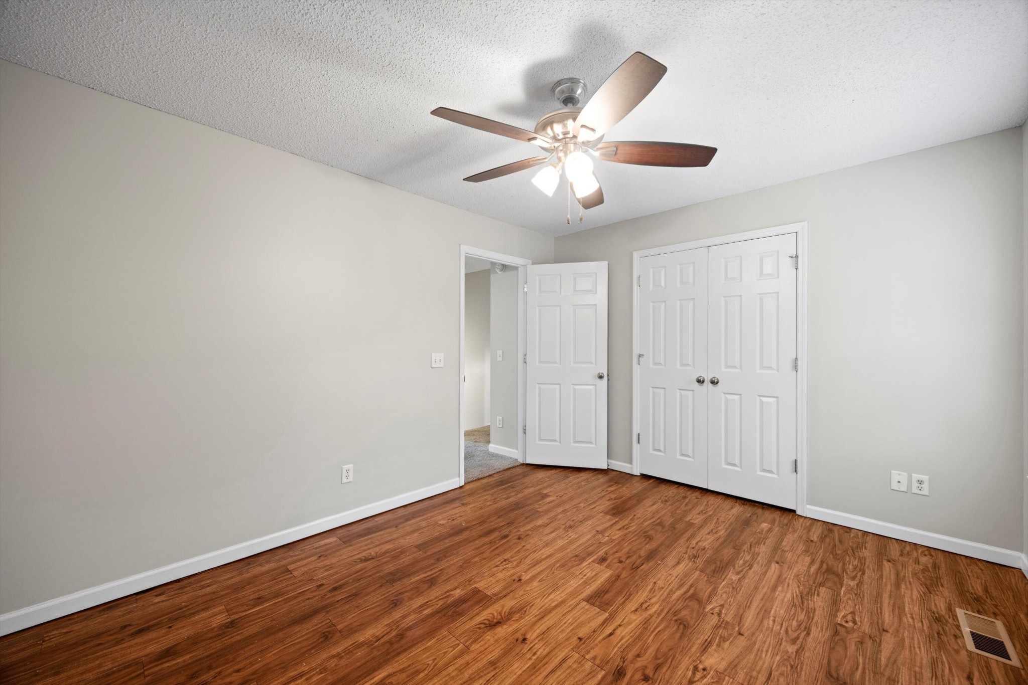 155 Priscilla Drive Ringgold, GA 30736 - Photo 14 of 19 a view of an empty room with wooden floor and a ceiling fan