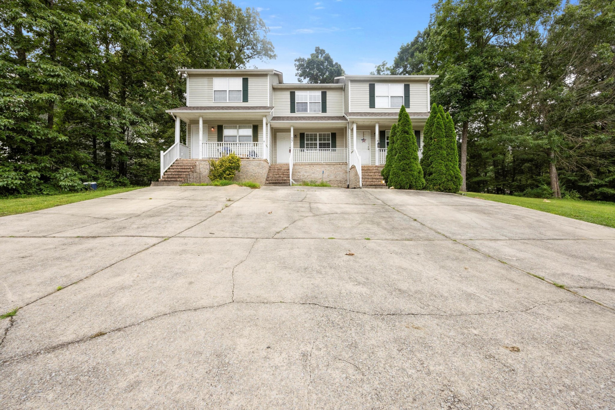 155 Priscilla Drive Ringgold, GA 30736 - Photo 2 of 19 a front view of a house with a yard and trees