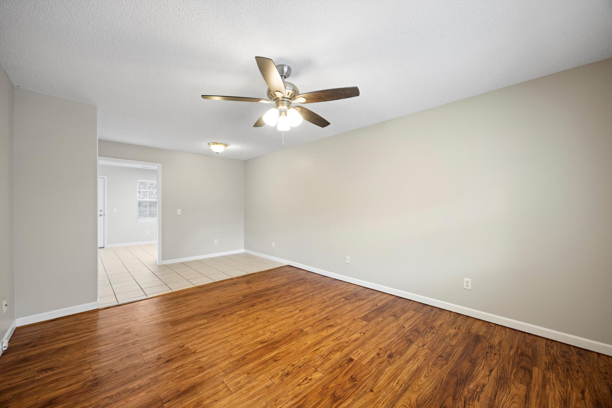 155 Priscilla Drive Ringgold, GA 30736 - Photo 5 of 19 an empty room with wooden floor and fan