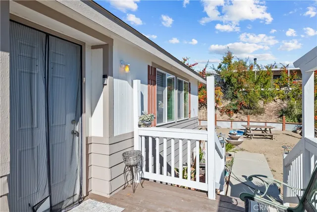 a view of a terrace with furniture and a fire pit