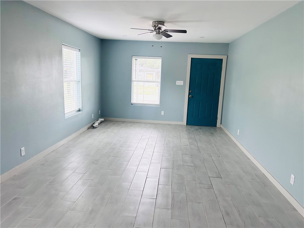 516 East 6th Street, Unit A Alice, TX 78332 - Photo 7 of 16 a view of an empty room with a window