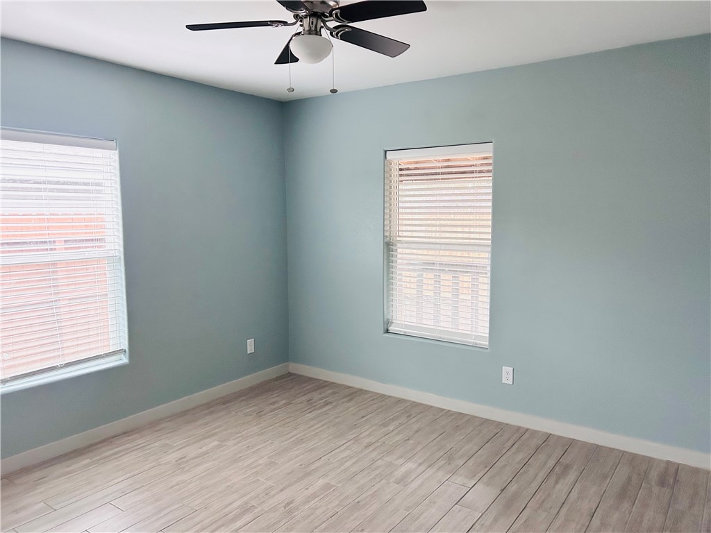 516 East 6th Street, Unit A Alice, TX 78332 - Photo 8 of 16 a view of an empty room with a window