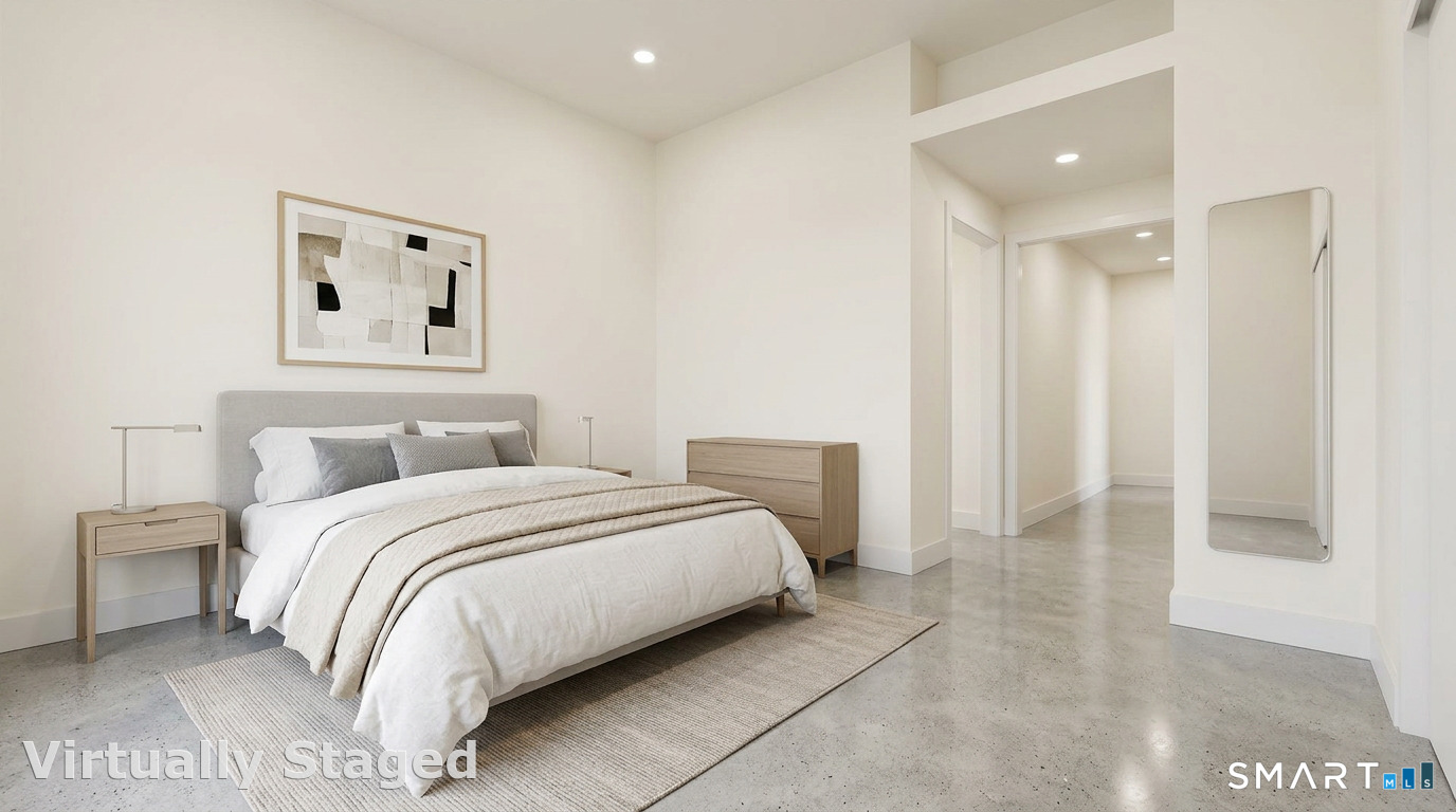 40 Pond Road Old Lyme, CT 06371 - Photo 24 of 35 a bedroom with a bed and a painting