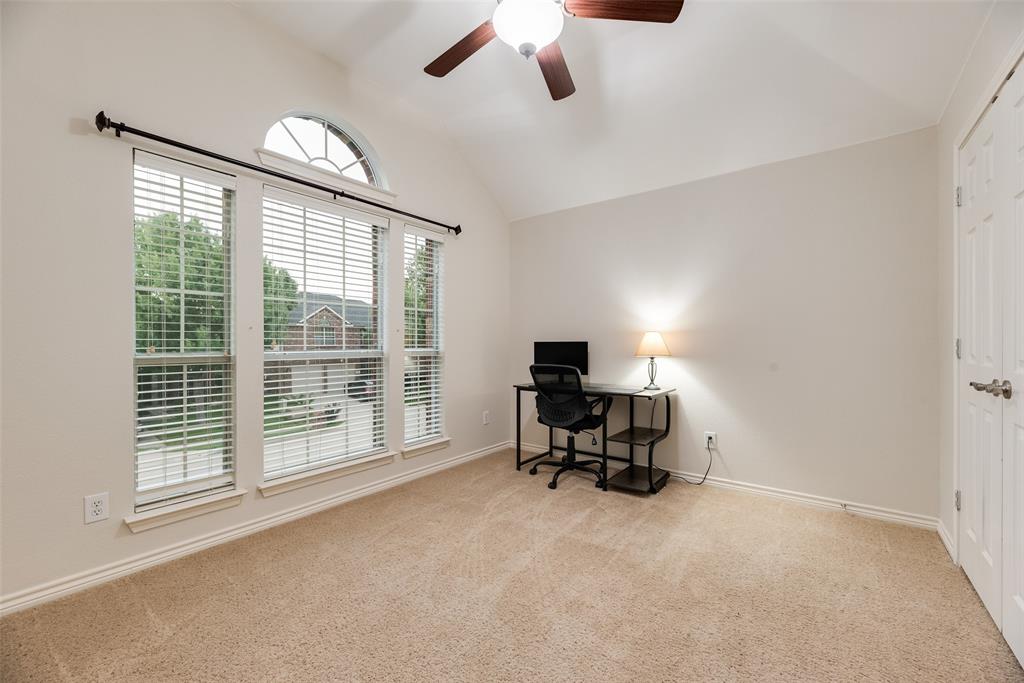 11920 Vienna Apple Road Fort Worth, TX 76244 - Photo 29 of 40 Upstairs bedroom with ceiling fan at 11920 Vienna Apple in Villages of Woodland Springs community in North Fort Worth