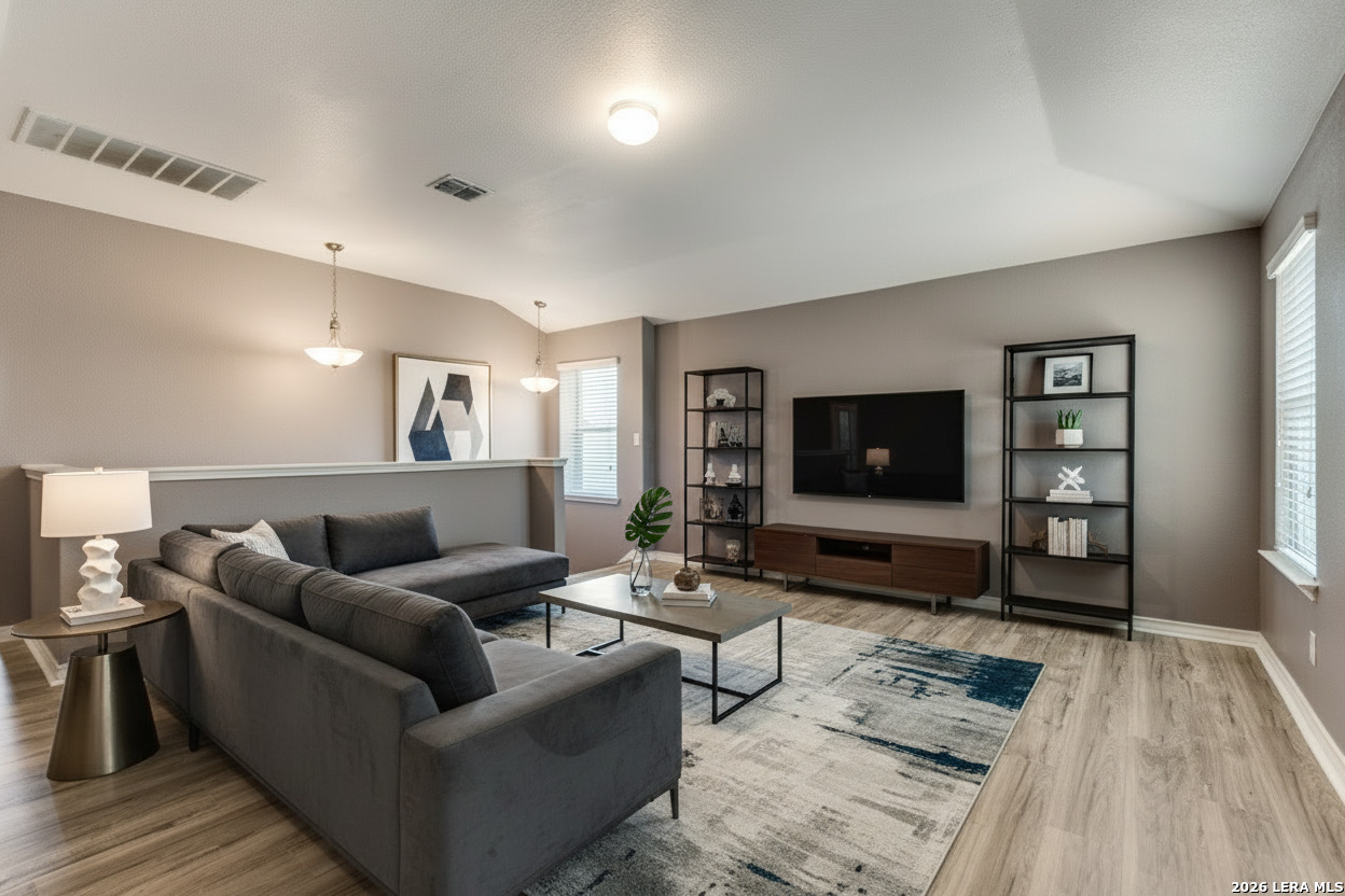 7522 Rigel Chase San Antonio, TX 78252 - Photo 12 of 19 a living room with furniture and a flat screen tv