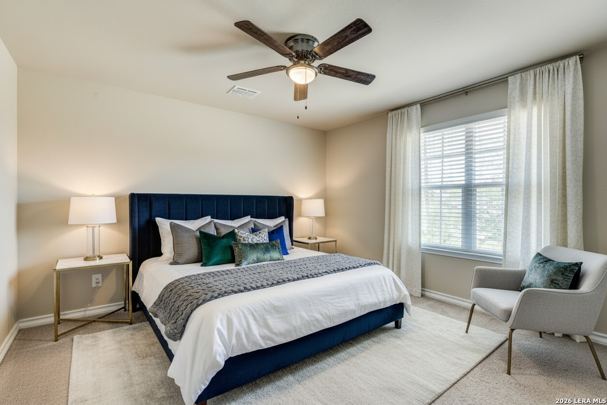 7522 Rigel Chase San Antonio, TX 78252 - Photo 15 of 19 a bedroom with bed and window