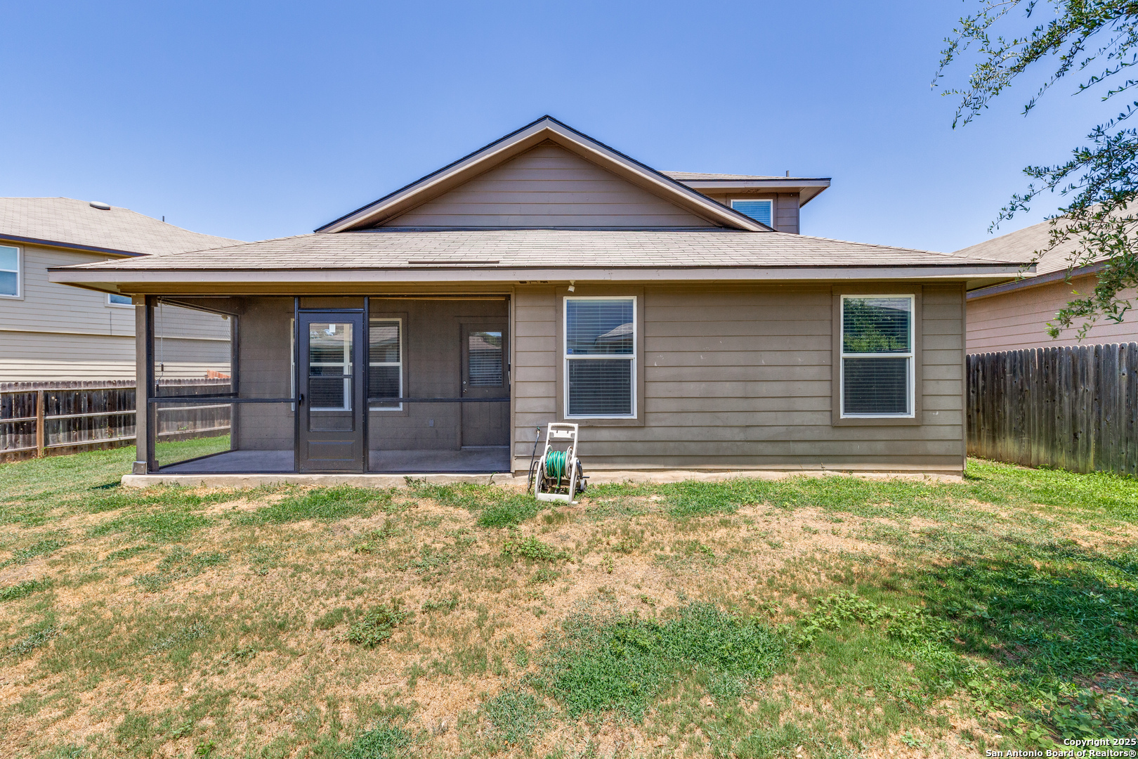 7522 Rigel Chase San Antonio, TX 78252 - Photo 17 of 19 a front view of a house with garden
