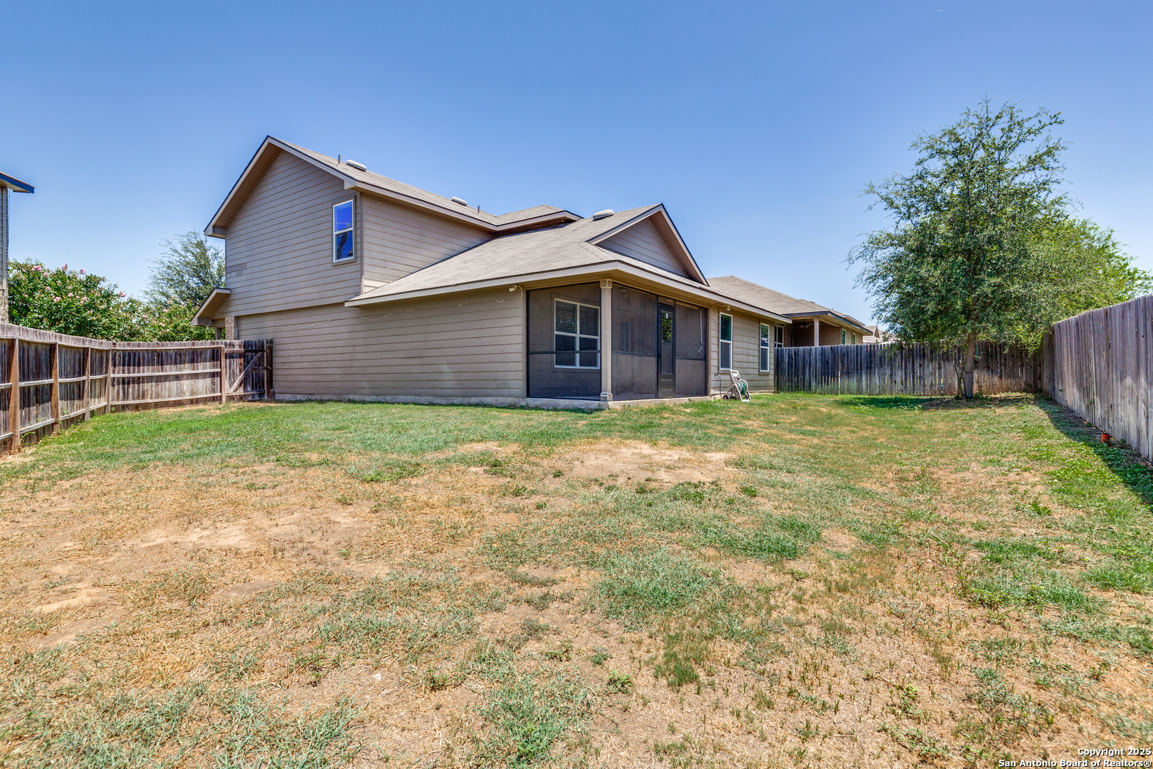 7522 Rigel Chase San Antonio, TX 78252 - Photo 18 of 19 a view of a house with a yard and sitting area
