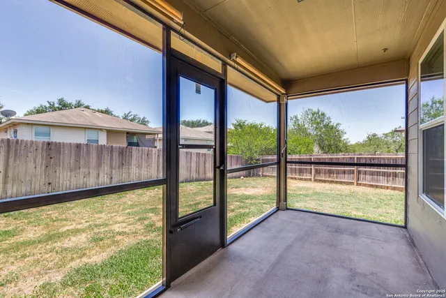 a view of a porch with a backyard