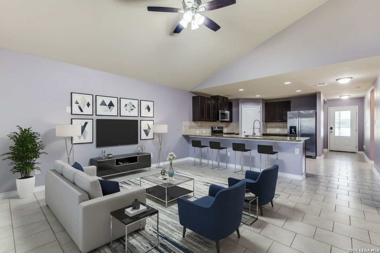 7522 Rigel Chase San Antonio, TX 78252 - Photo 5 of 19 a living room with furniture and a flat screen tv