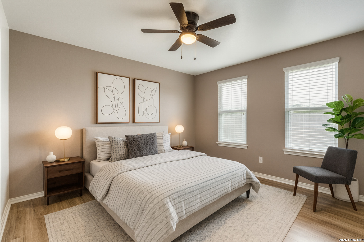 7522 Rigel Chase San Antonio, TX 78252 - Photo 9 of 19 a bedroom with a bed and a chair