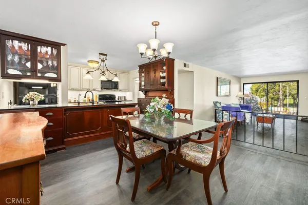 a view of a dining room with furniture and window