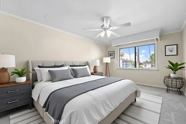 a bedroom with a bed and window
