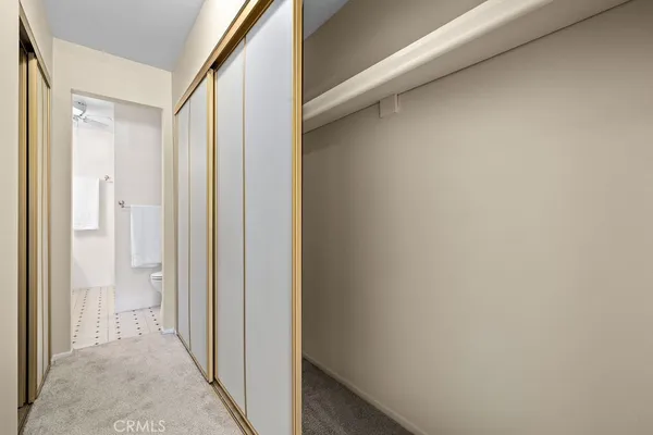 a view of a bathroom from a hallway