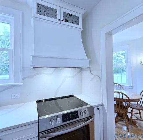 a view of washer and dryer with kitchen in the background