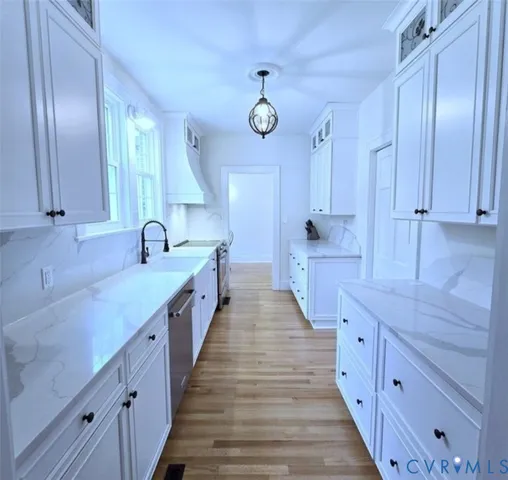 a large kitchen with double vanity and a large window
