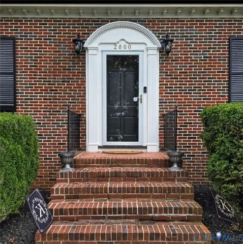 a view of a brick house with a door