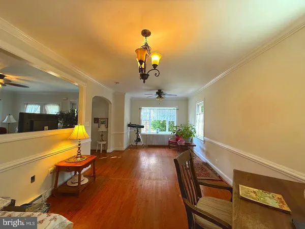 a view of a livingroom with furniture window and wooden floor