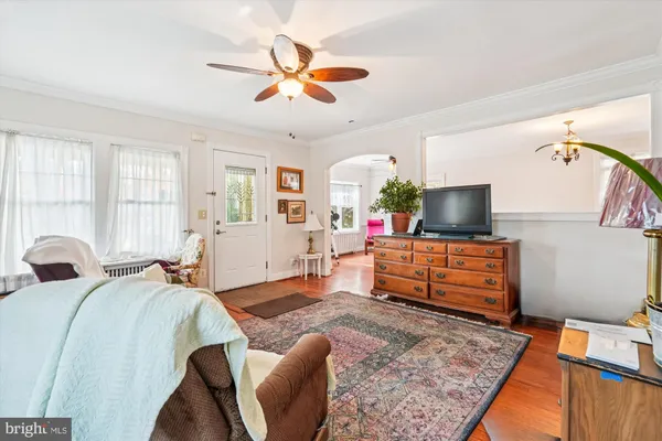 a bedroom with furniture and a flat screen tv