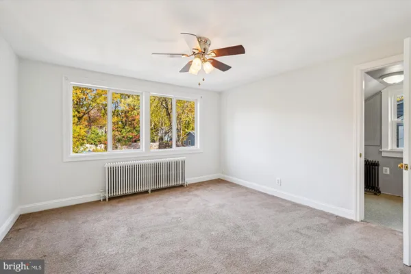 a view of a hallway to a bedroom