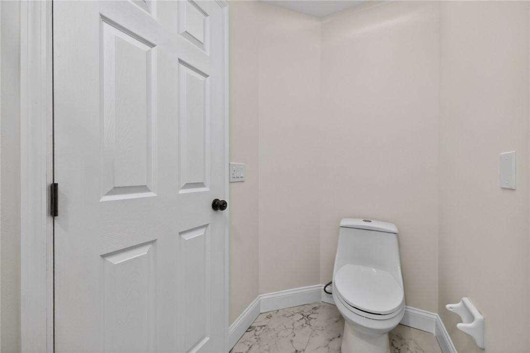 811 Wind Bluff Point Springboro, OH 45066 - Photo 23 of 51 This clean and bright powder room features crisp white walls and elegant tile flooring.