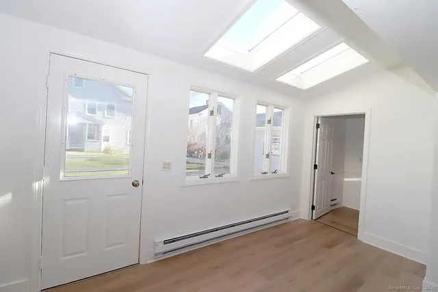 a view of an empty room and window