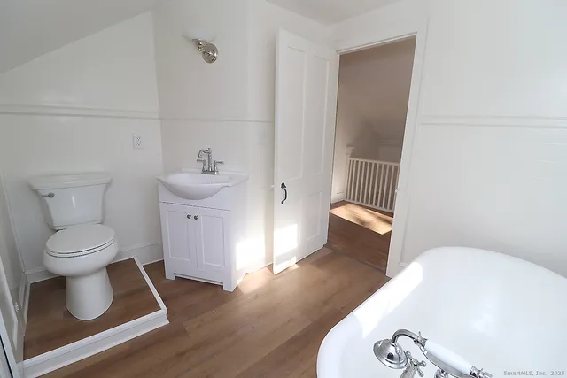 a bathroom with a toilet and a sink