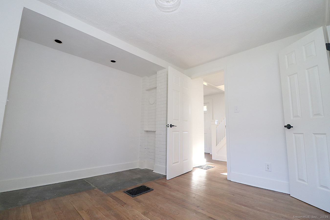 9 John Street Winchester, CT 06098 - Photo 8 of 23 a view of an empty room with wooden floor